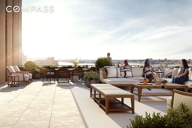 view of patio / terrace featuring outdoor lounge area and a city view