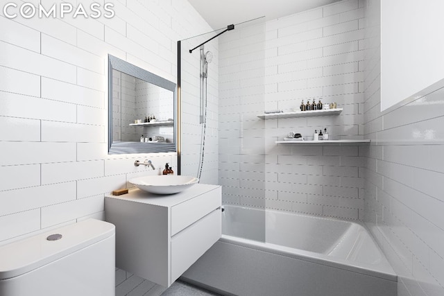 full bathroom with tile walls, vanity, tiled shower / bath combo, and toilet