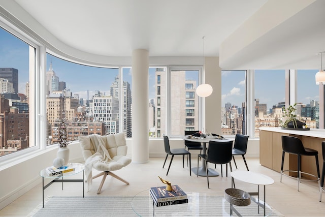 sunroom / solarium featuring a view of city