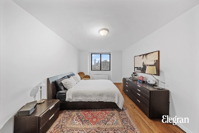 bedroom with light hardwood / wood-style floors