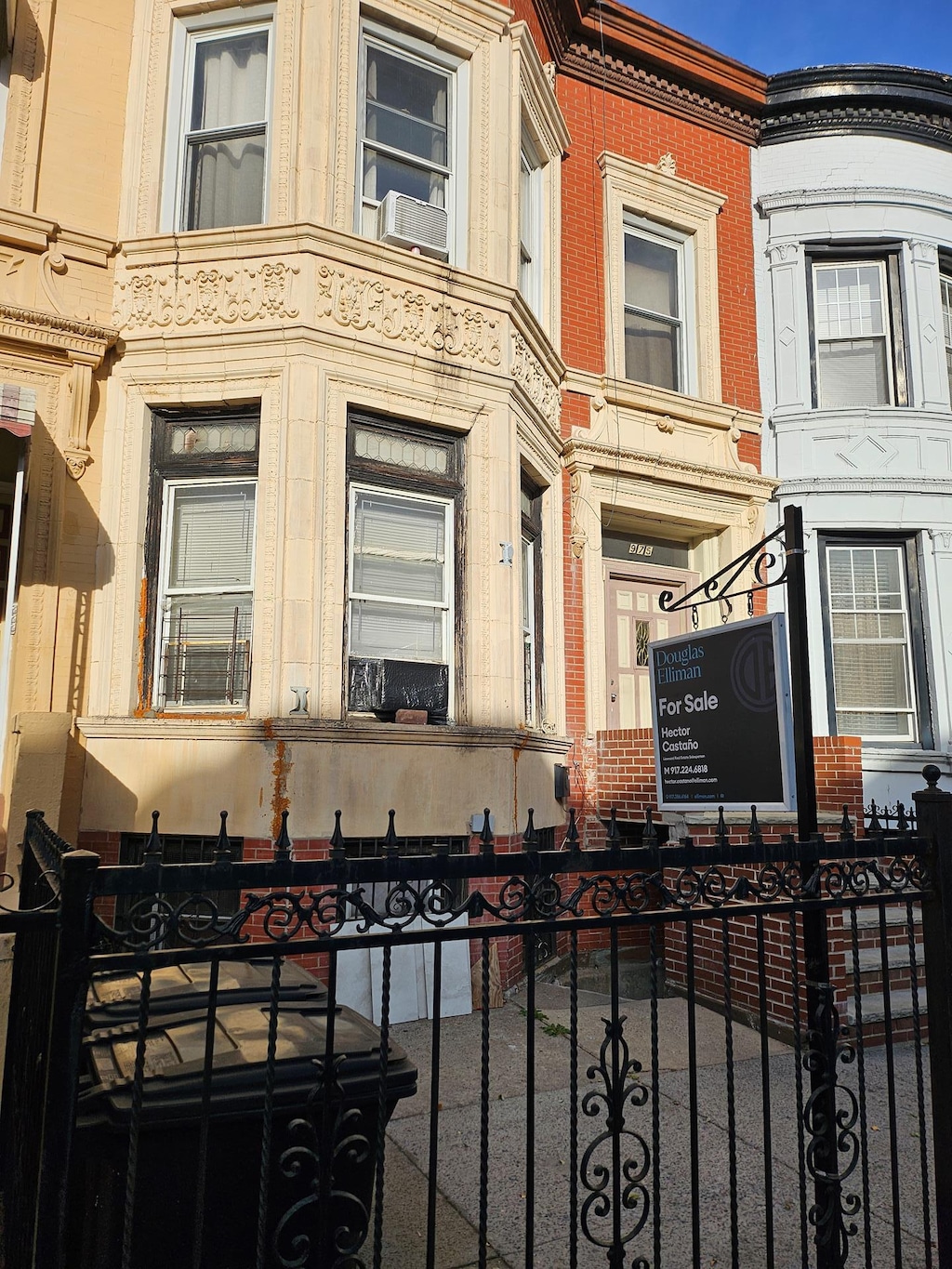 view of property exterior with cooling unit and fence