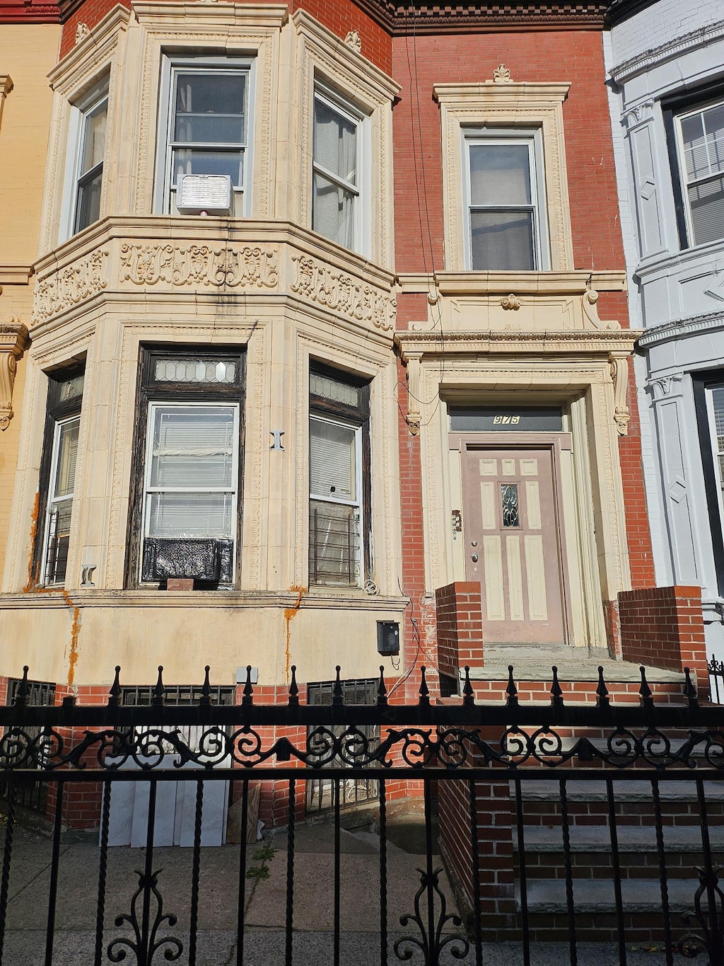 entrance to property featuring fence