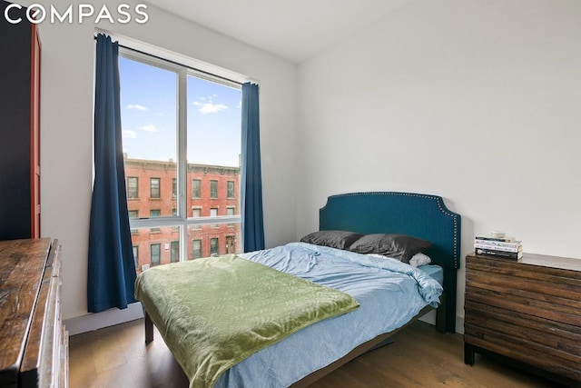 bedroom with hardwood / wood-style flooring