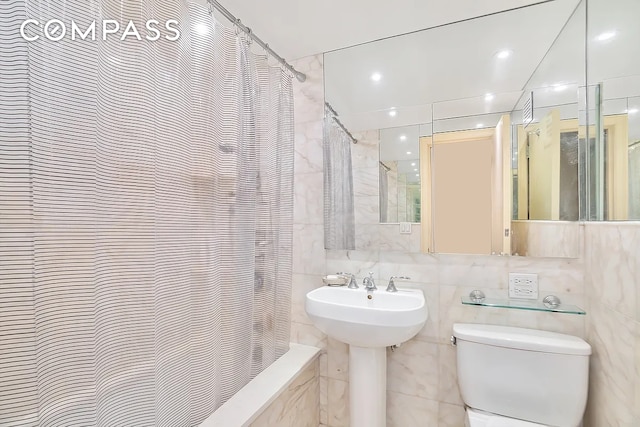 50 Sutton Pl S Unit 2D, New York City, NY 10022 - bathroom with tile walls and shower / bathtub combination with curtain