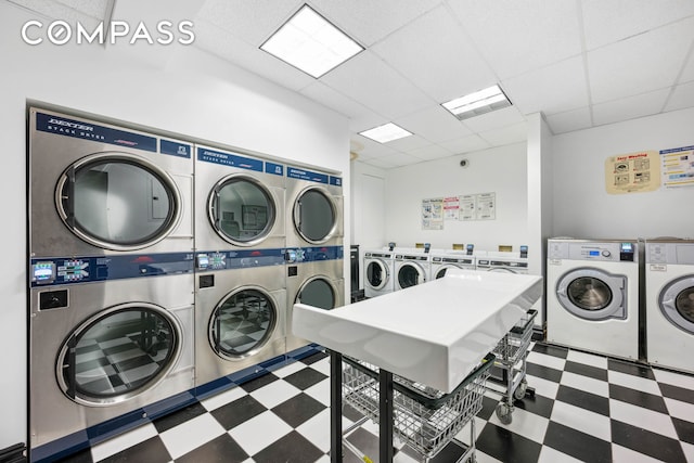 25 5th Ave Unit 6C, New York City, NY 10003 - communal laundry room featuring tile patterned floors, stacked washer / drying machine, and separate washer and dryer