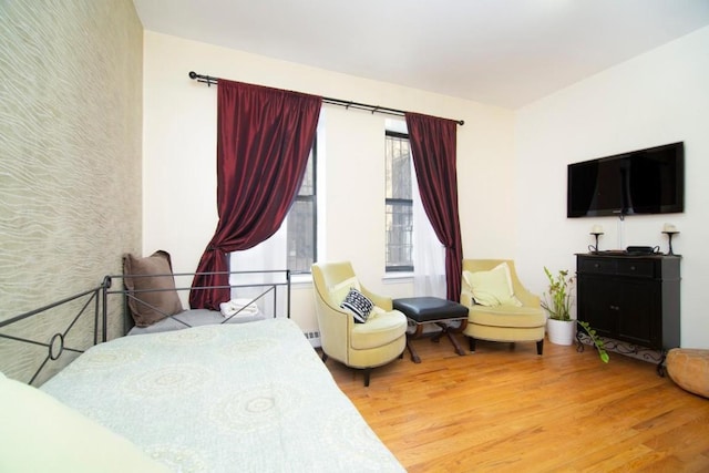 bedroom with wood finished floors