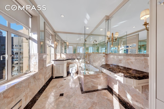 465 Park Ave Unit 34E, New York City, NY 10022 - full bath featuring a bath, marble tiled floors, vanity, a chandelier, and tile walls