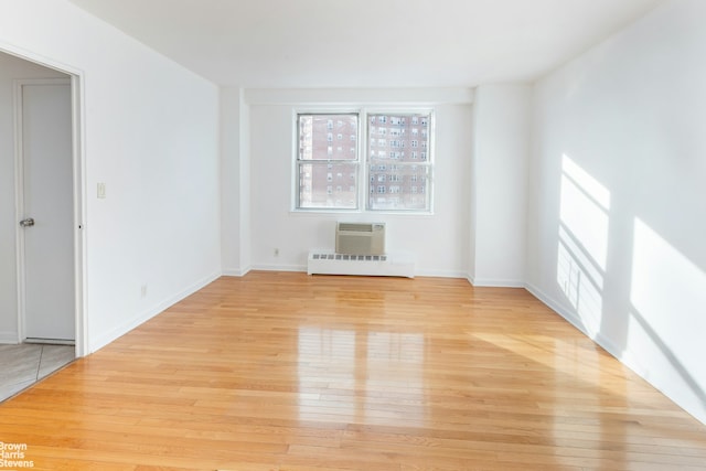 5800 Arlington Ave Unit 9H, New York City, NY 10471 - empty room with light wood finished floors and a wall unit AC