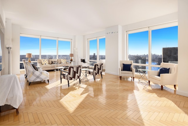 sunroom / solarium featuring a view of city