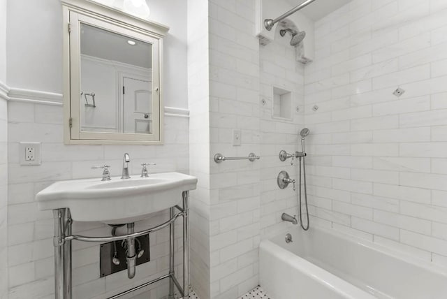 bathroom featuring shower / bath combination and tile walls