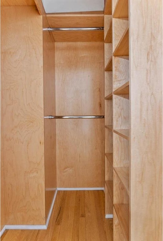 spacious closet with wood finished floors