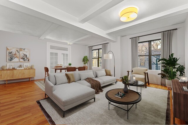 living room with light hardwood / wood-style floors and beamed ceiling