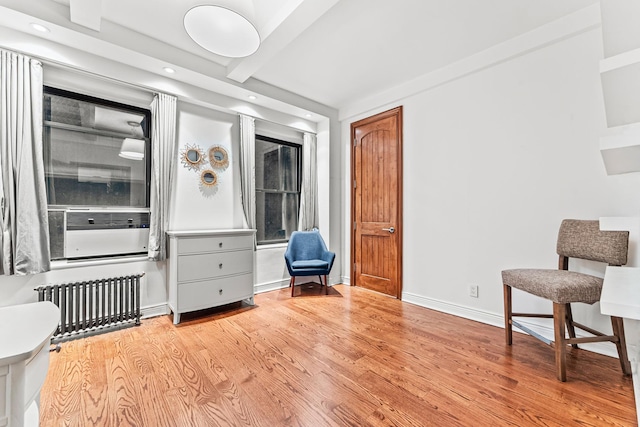 60 W 68th St Unit 5-Bc, New York City, NY 10023 - living area with radiator, wood finished floors, recessed lighting, beamed ceiling, and baseboards