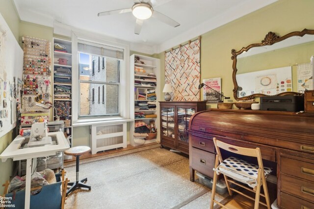 office featuring ceiling fan and crown molding