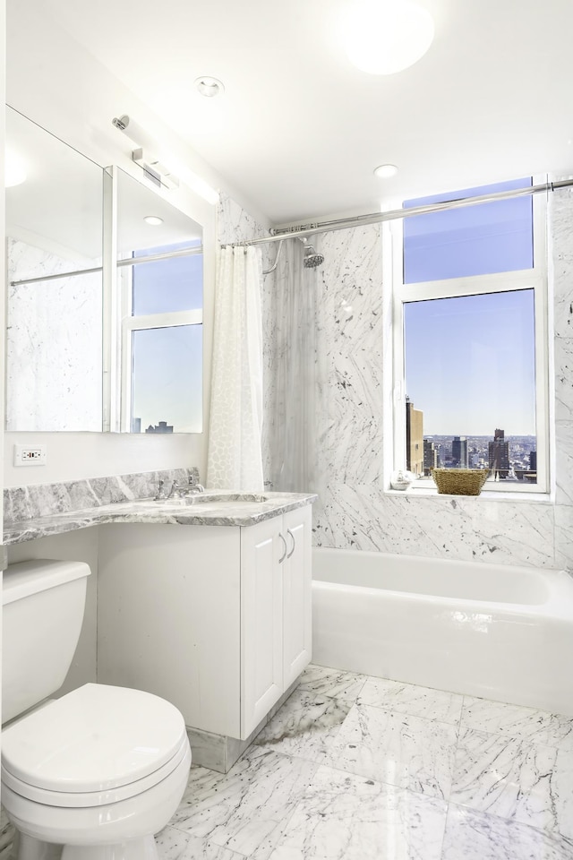 full bath with toilet, vanity, shower / bath combo with shower curtain, and marble finish flooring