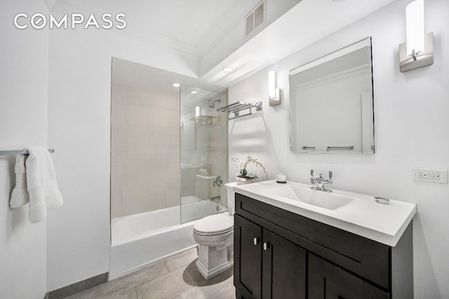 full bathroom with tiled shower / bath, tile patterned flooring, vanity, toilet, and crown molding