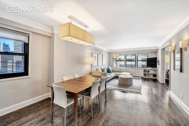 dining area featuring baseboards, ornamental molding, and dark wood-style flooring