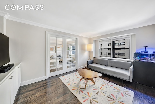 living room featuring baseboards, french doors, crown molding, and wood finished floors