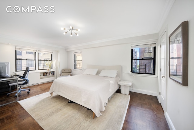 411 E 57th St Unit 11Ab, New York City, NY 10022 - bedroom featuring crown molding, baseboards, a desk, and a chandelier