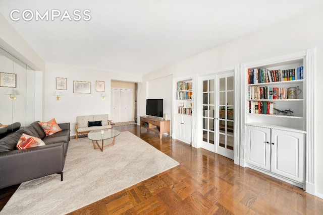 living room with french doors and parquet floors