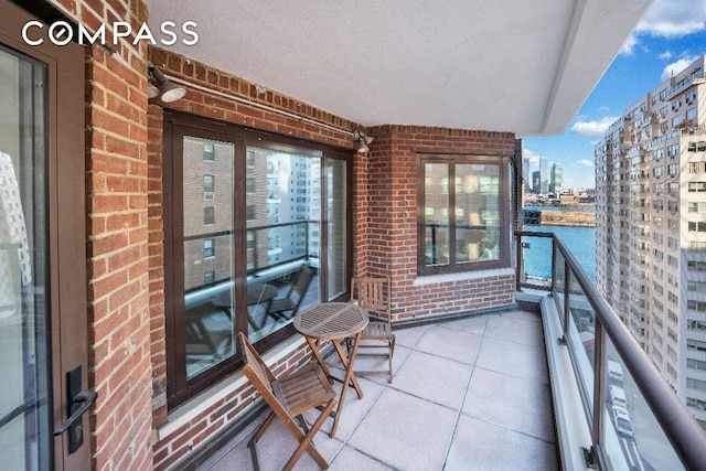 balcony featuring a water view