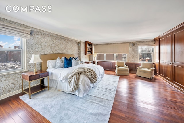 444 E 84th St Phe, Phe, New York City, NY 10028 - bedroom with wallpapered walls, multiple windows, dark wood finished floors, and crown molding