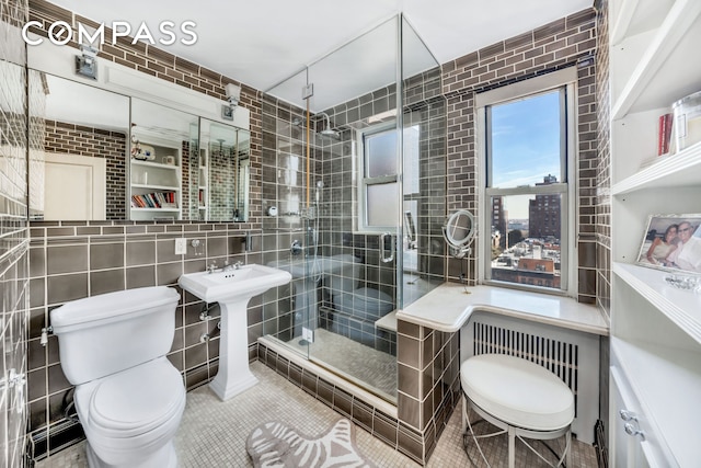 444 E 84th St Phe, Phe, New York City, NY 10028 - full bathroom with tile walls, a stall shower, tile patterned floors, and decorative backsplash