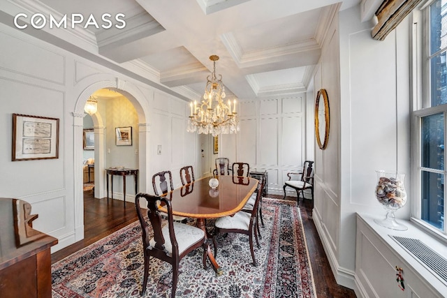 dining room with crown molding, coffered ceiling, dark wood-type flooring, and beam ceiling