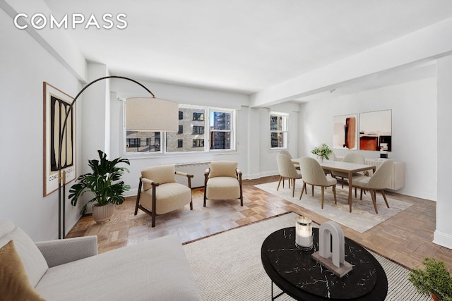 living room featuring light parquet flooring