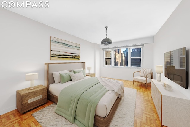 bedroom with light parquet floors