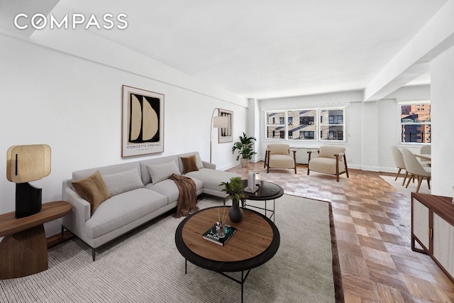 living room featuring light parquet flooring