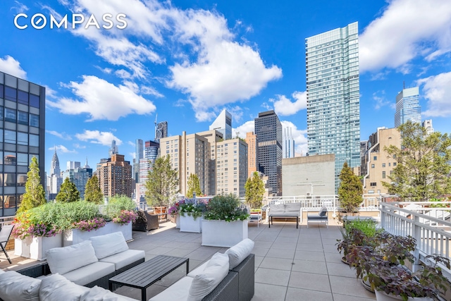 345 E 56th St Unit 11C, New York City, NY 10022 - view of patio / terrace with an outdoor living space and a skyline view