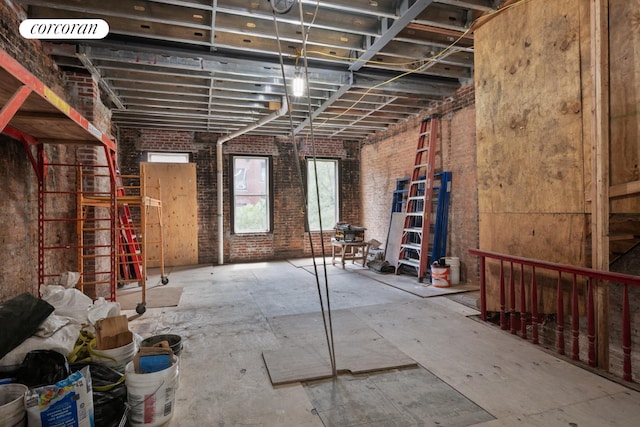 miscellaneous room with brick wall