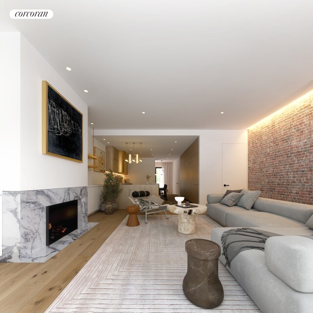 living room featuring wood-type flooring and expansive windows