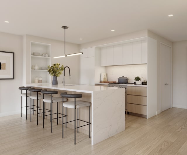 kitchen with white cabinets, modern cabinets, pendant lighting, light wood-style floors, and open shelves