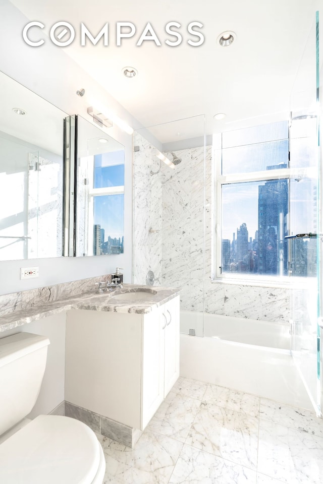 bathroom featuring toilet, a skyline view, vanity, shower / bathtub combination, and recessed lighting