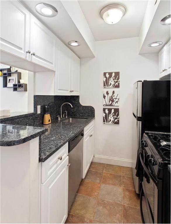 kitchen with sink, white cabinetry, and appliances with stainless steel finishes