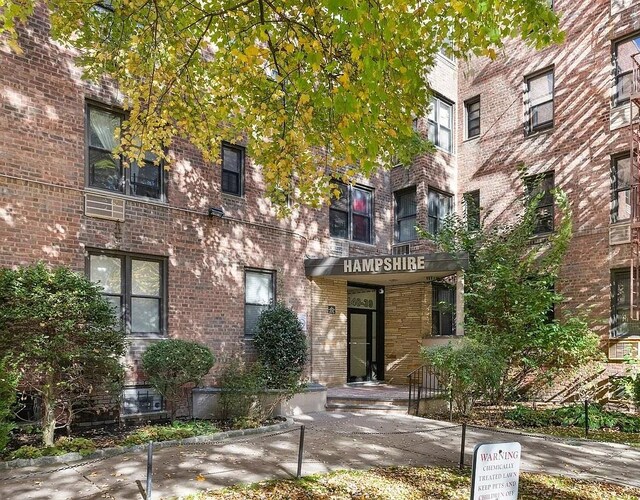 view of exterior entry with brick siding