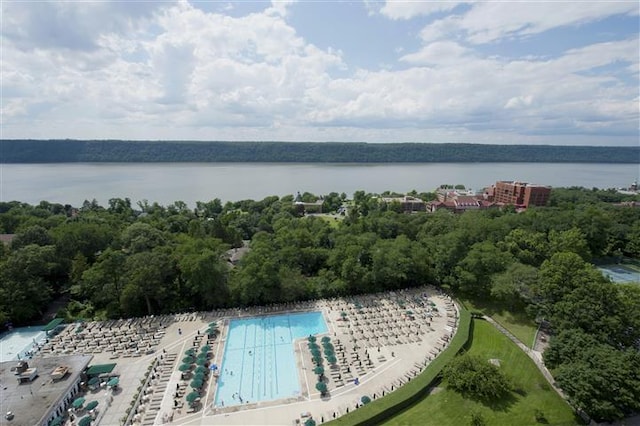 birds eye view of property with a water view