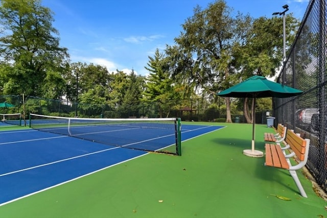 view of sport court with fence