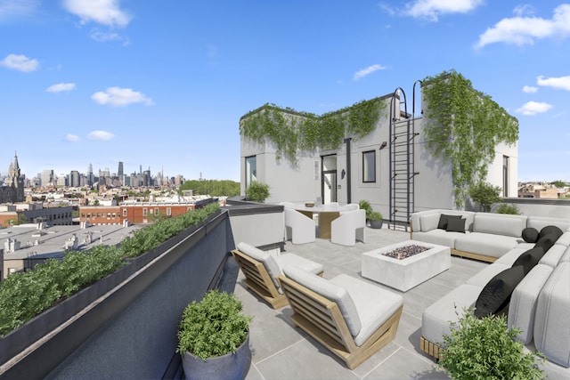 view of patio / terrace with an outdoor living space with a fire pit