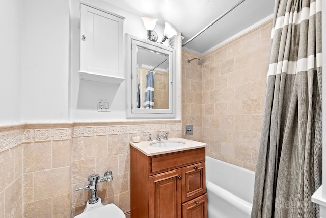 bathroom featuring vanity, tile walls, and shower / tub combo with curtain