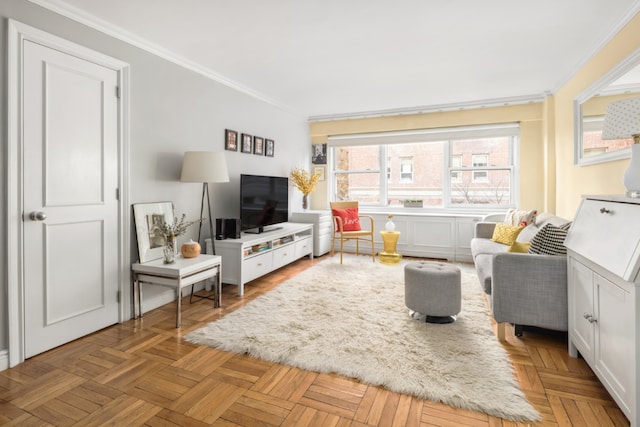 living room with ornamental molding and light parquet flooring