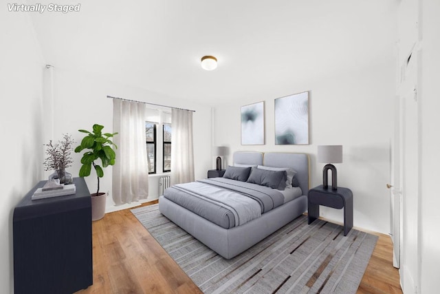 bedroom with wood-type flooring