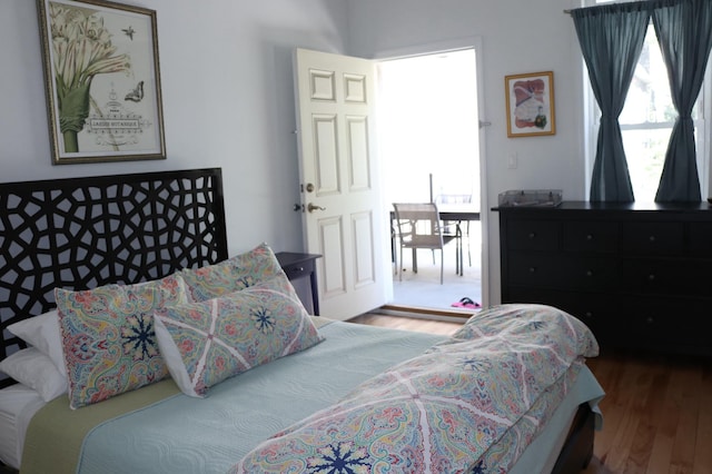 bedroom with wood finished floors