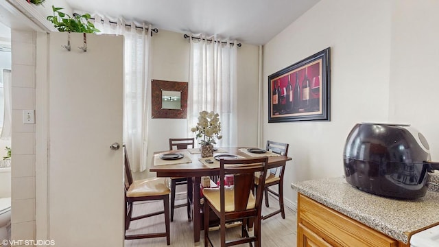 dining space featuring light wood-type flooring