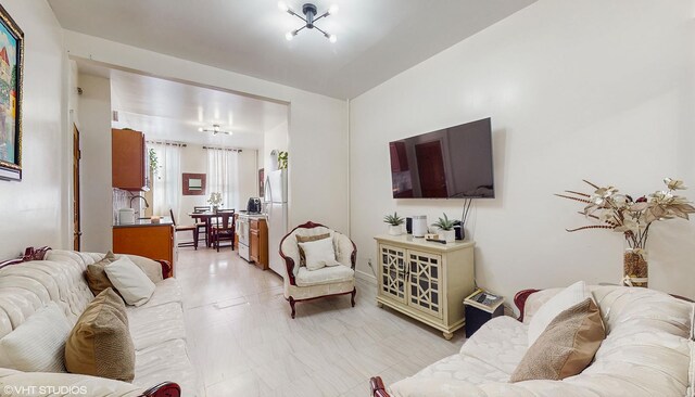 living room featuring a chandelier