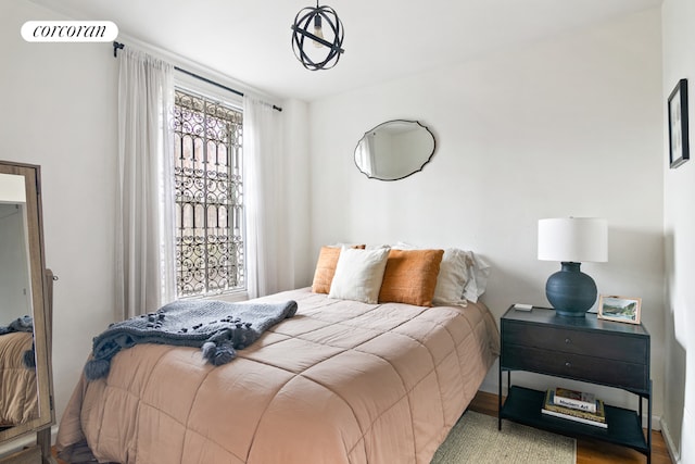 bedroom with light hardwood / wood-style floors