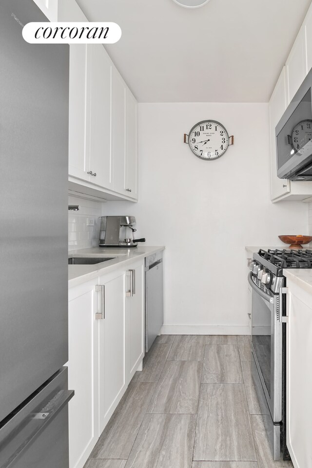 kitchen featuring white cabinets and stainless steel appliances