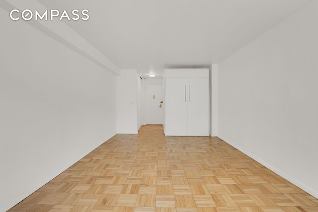 69 W 9th St Unit 8H, New York City, NY 10011 - unfurnished room featuring baseboards